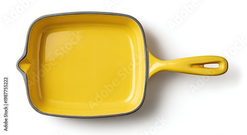 Bright yellow square cast iron skillet with gray rim, white background