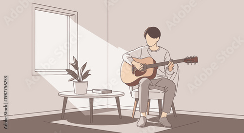 Man playing acoustic guitar sitting down.