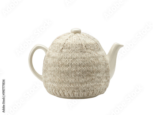 Canvas Print Elegant cream ceramic teapot wrapped in a cozy hand-knitted oatmeal wool cover f