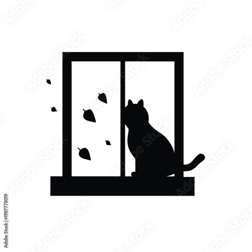 Black cat silhouette sitting on a windowsill looking out at falling leaves