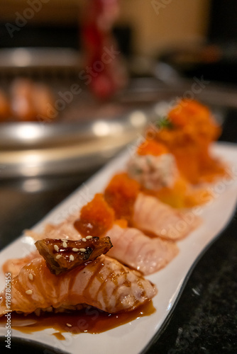 Set of Salmon aburi sushi with saikyo sauce on plate