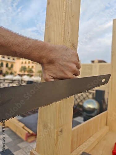 carpenter cutting wood