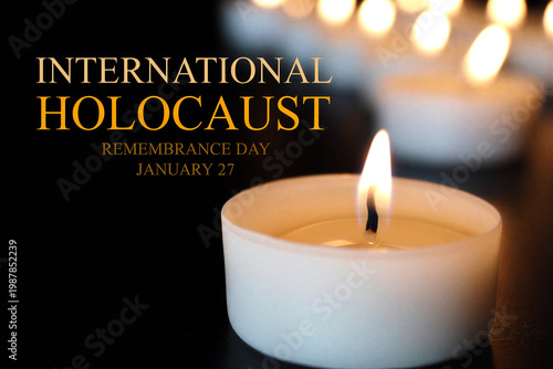 Lit memorial candle for international holocaust remembrance day with soft background lights and text