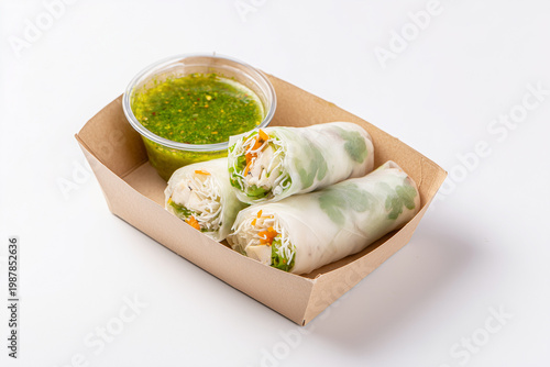 Fresh spring rolls with vegetables and dipping sauce asian cuisine isolated on white background
