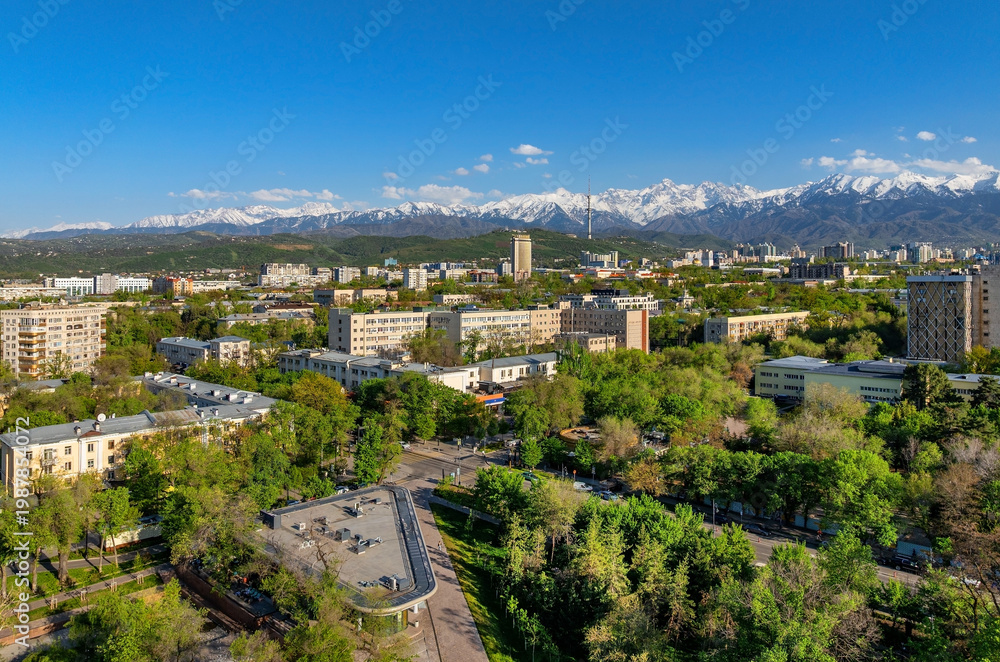 Fototapeta premium A quadcopter aerial view of the central part of Almaty, Kazakhstan, during the spring day