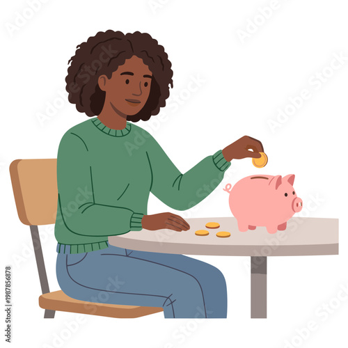 A woman sitting at a table is putting a coin into a pink piggy bank.