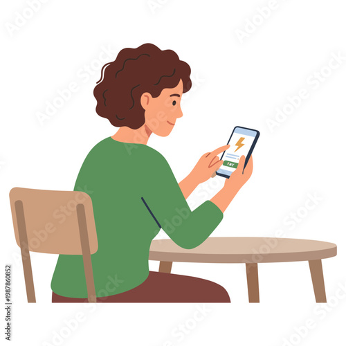 Woman sits at table looking at phone with interest indoors