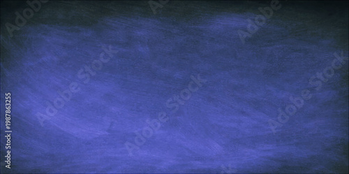 A dark vintage blue grunge background with purple textured paint and pink light provides an aged paper wall canvas design for use as an artistic wallpaper backdrop with ample copy space