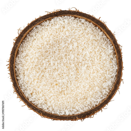 Grated coconut flakes in a half coconut shell isolated on a transparent background
