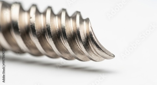 Close-up Macro Of A Metal Screw Tip Showing Thread Details And Sharp Point