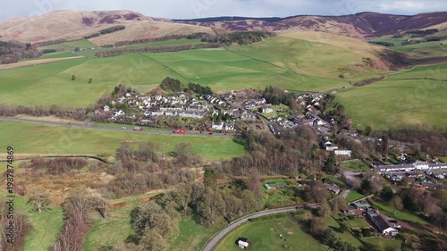 Cinematic view of the picturesque village of Eddleston showcasing Scottish architecture and scenic valley landscape.