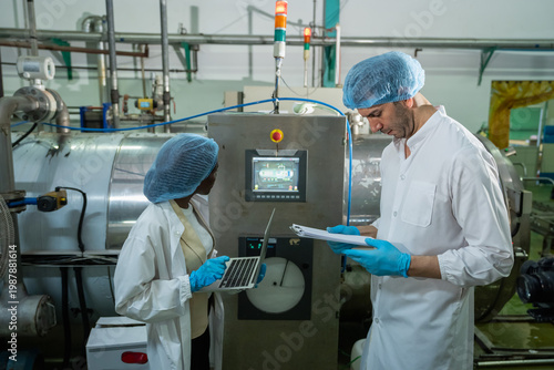 Quality assurance process in food industry factory technical meeting controlled environment close-up view collaboration