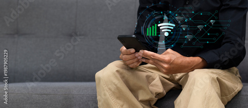 hand of man using smartphone with wifi network connection, social media, application while sitting on sofa at home or cafe and copy space