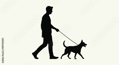 A man walking his dog on a leash dark silhouette