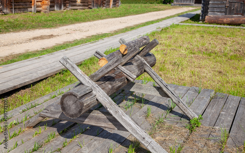 Wooden Sawhorses Near Traditional Village House