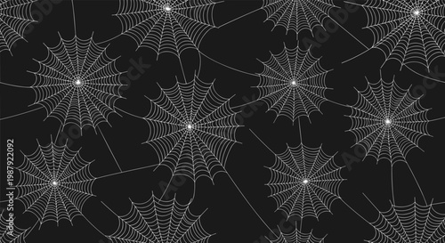 Spooky seamless pattern of intricate white spider webs scattered across a solid black background for halloween or gothic holiday themes.