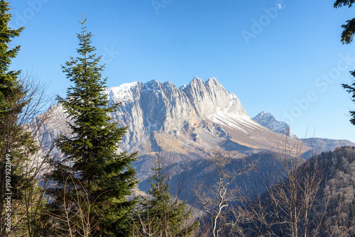 Autumn, a fragment of a mountain range in the light of the daytime sun, dried vegetation and nature walks