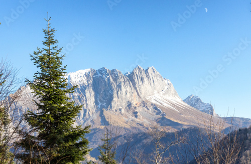 Autumn, a fragment of a mountain range in the light of the daytime sun, dried vegetation and nature walks