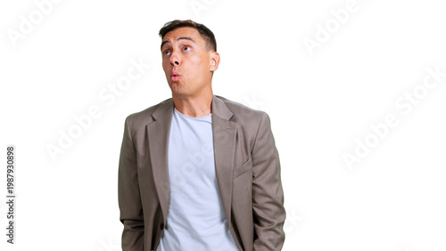 A man looks up, whistling, trying to hide something