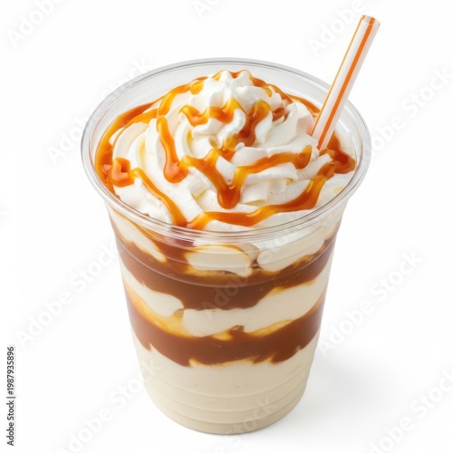 A delicious layered dessert in a clear cup with a straw and caramel drizzle on top