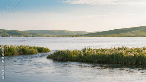 Slika na platnu lake and mountains,
A wide river flows through hills