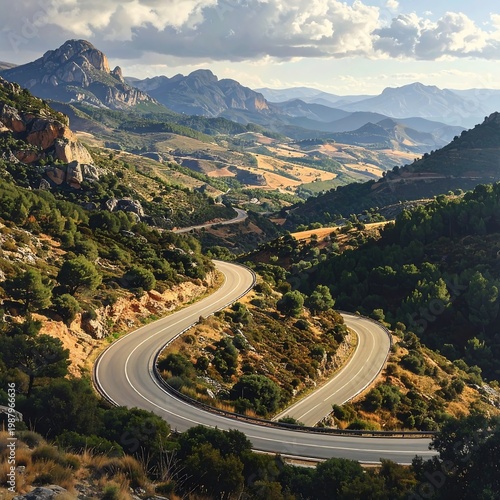 A winding road through a mountainous landscape with trees