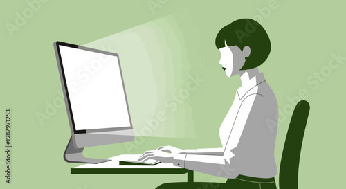woman sitting at desk with computer.