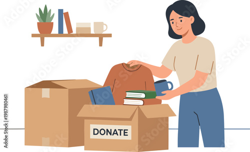 A woman donates books and clothes into a cardboard donation box indoors.