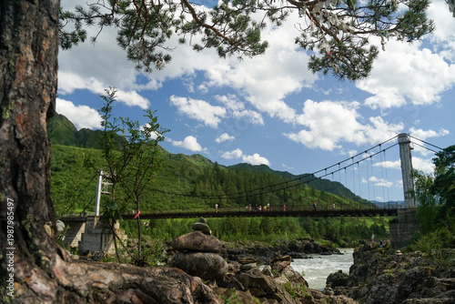 bridge over a mountain river in the mountains, summer landscape