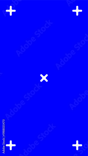 Blue screen with white crosshairs marking tracking points for video chroma keying element