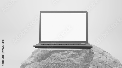 A modern laptop with a white screen sits on a white pedestal against a white background, perfect for design and tech presentations.