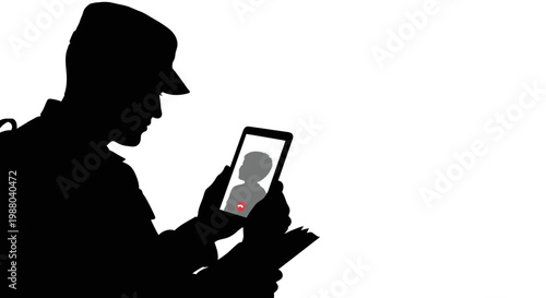 Silhouette of Soldier Video Calling on Smartphone, Connecting with Family During Deployment