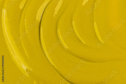 soft waves of delicate pistachio creamy pastry cream or paste. Bright, rich texture color. culinary confectionery background. layout for design.