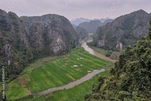 High-angle panoramic view of Ninh Binh karst landscape and villages from Mua Caves