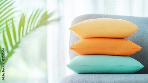 Colorful pillows stacked on a chair, offering a soft and inviting spot for relaxation.