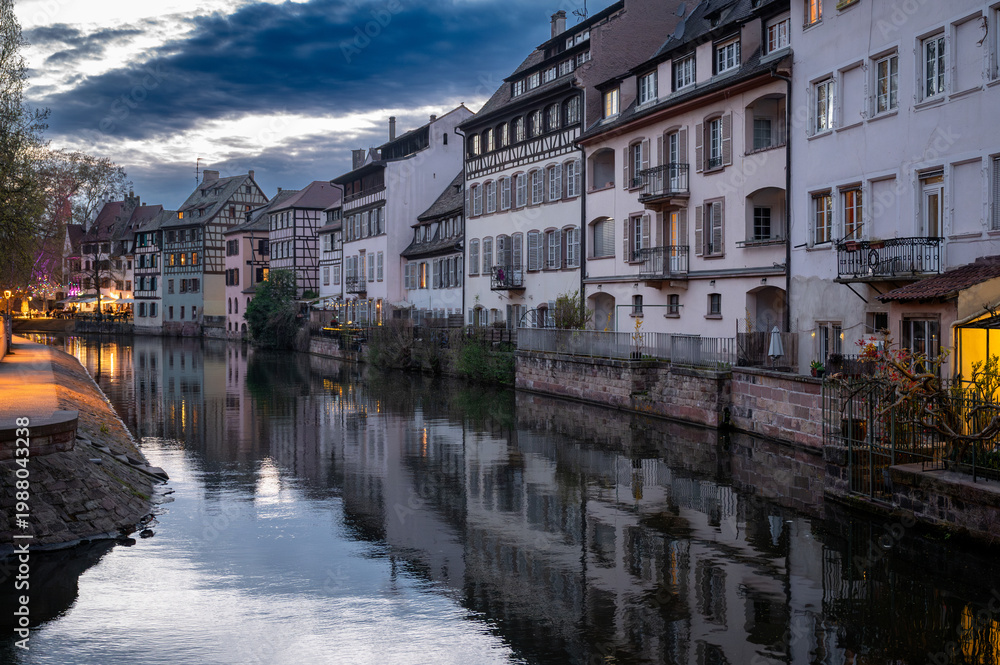 Obraz premium Evening Postcard View Petite France Canal Glowing Windows