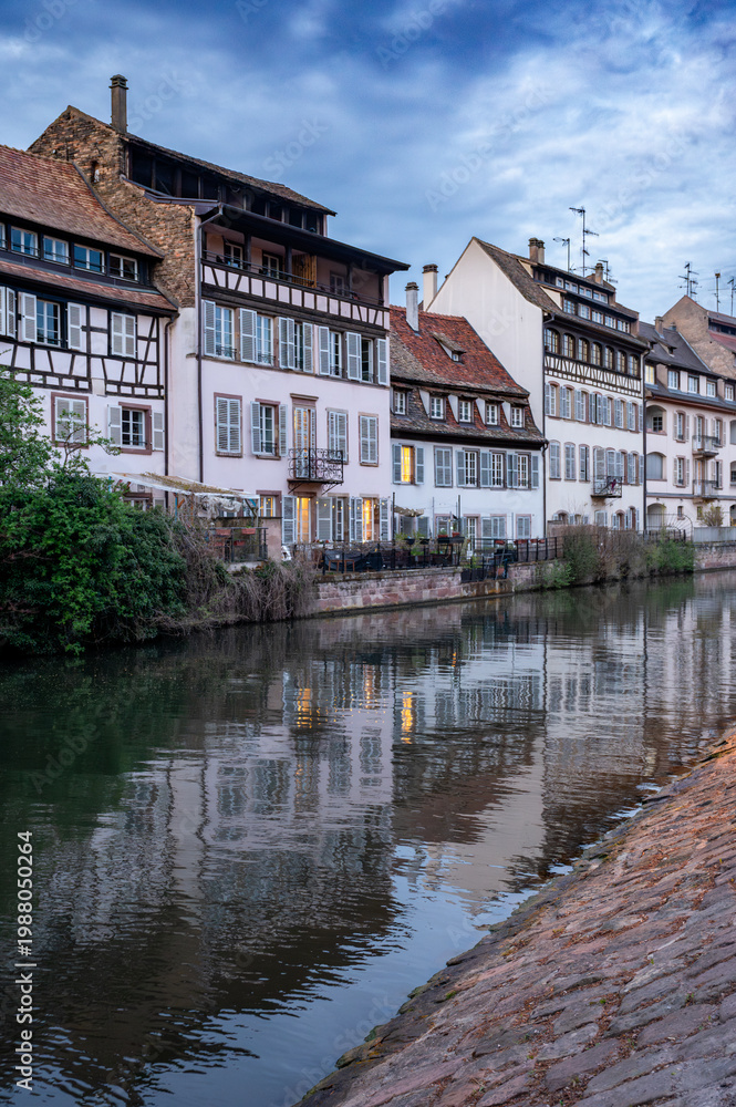 Naklejka premium Dusk Canal Reflections Timbered Houses Cobblestone Walk