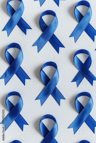 Blue awareness ribbons pattern on white background. Awareness campaign concept.