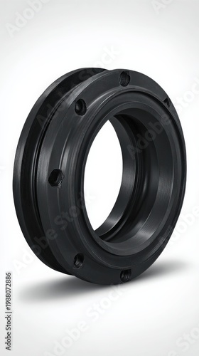 Close up view of a black mechanical component with smooth finish and circular shape