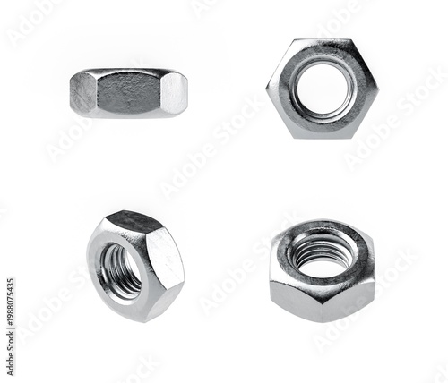 A set of four metallic nuts displayed on a white background, showcasing different angles and perspectives. Ideal for hardware and industrial themes.