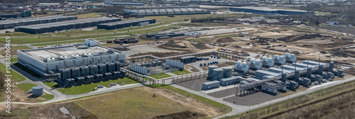 Cuadro en lienzo Large-scale data center campus with extensive computing facilities, dedicated energy supply systems, and advanced cooling infrastructure with extended infrastructure under construction