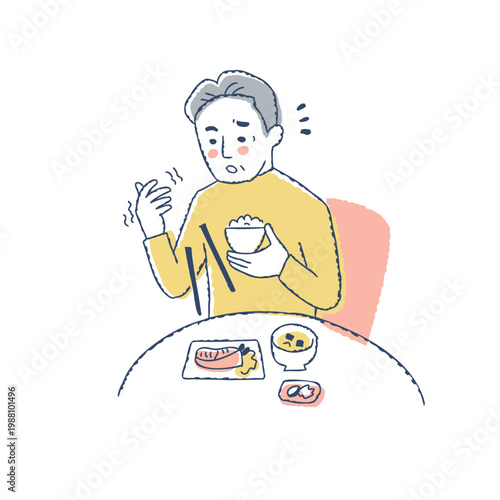 食事中に手から箸を落とすシニア男性