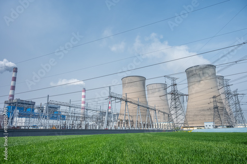 Coal-Fired Power Station with Hyperbolic Cooling Towers, Substation, and Vibrant Wheat Field