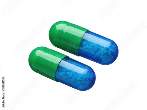 Two blue and green capsules isolated on transparent background pharmaceutical medicine