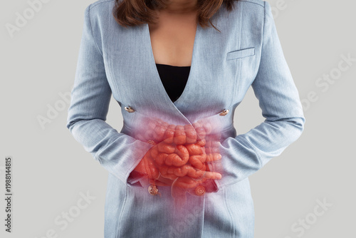 Woman holding abdomen with highlighted intestines showing digestive problems, inflammation, or gastrointestinal pain in a medical concept.