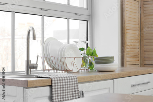 Bild auf Leinwand Sink and clean dishes on counter in kitchen