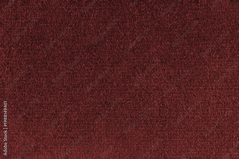 Fototapeta premium Close up, macro of red fabric texture with soft velvet, fluffy woven surface, rich textile detail. Knitted jersey cloth background, backdrop, wallpaper for design, fashion or interior projects
