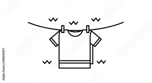 T Shirt Drying on Clothesline with Clothespins.