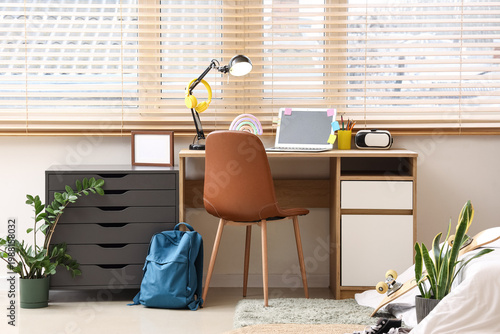 Stylish teenage room with c...