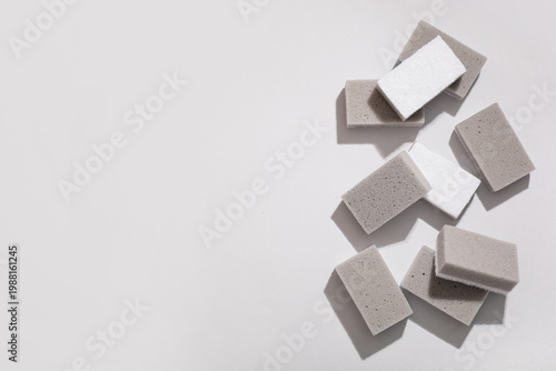 Many cleaning sponges on gr...